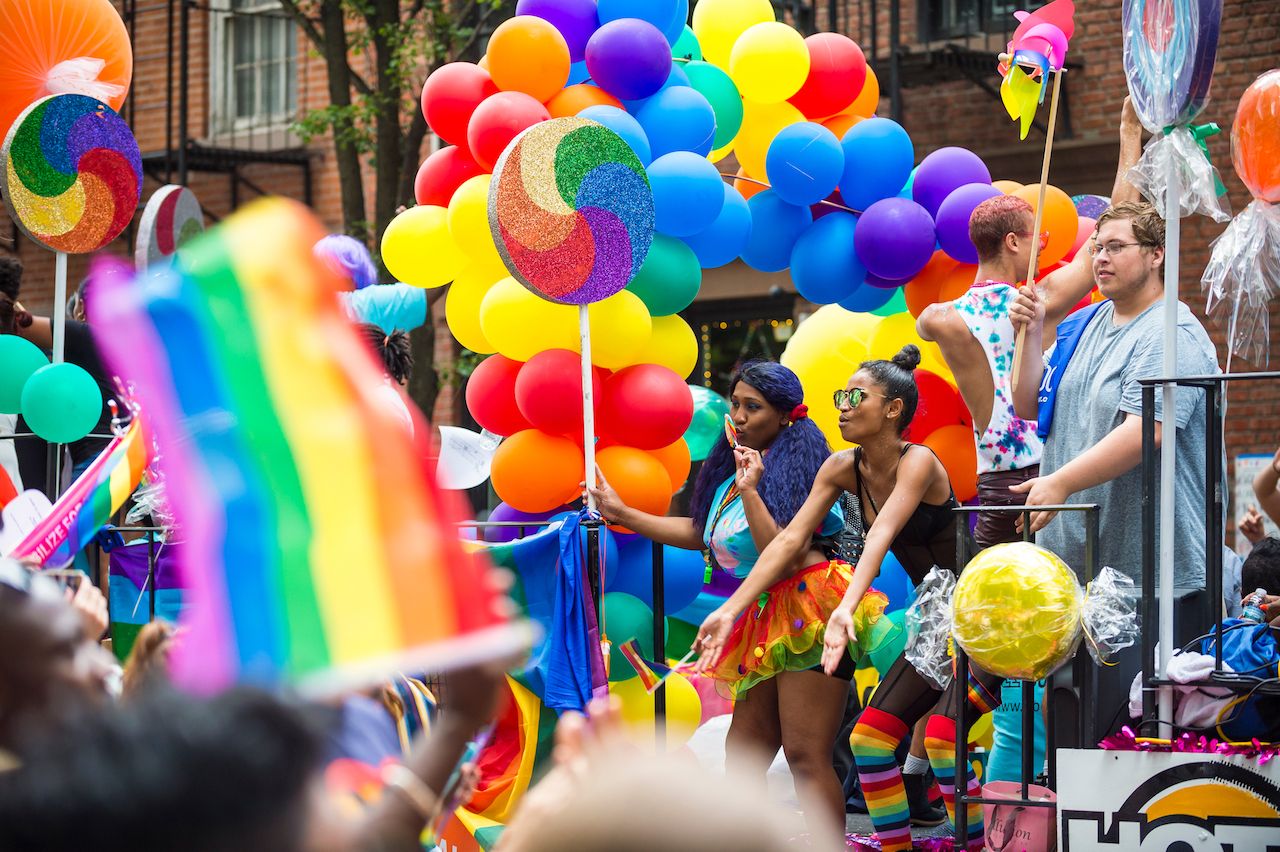 Colorful float at NYC Pride Parade as it passes through Greenwich Village