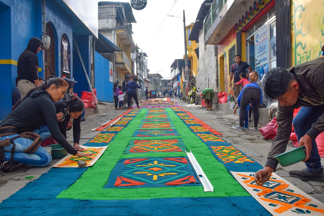 Making an alfombra in the streets of Guatemala